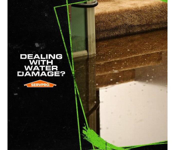 Standing water on carpet at the bottom of stairs, with the caption: DEALING WITH WATER DAMAGE?