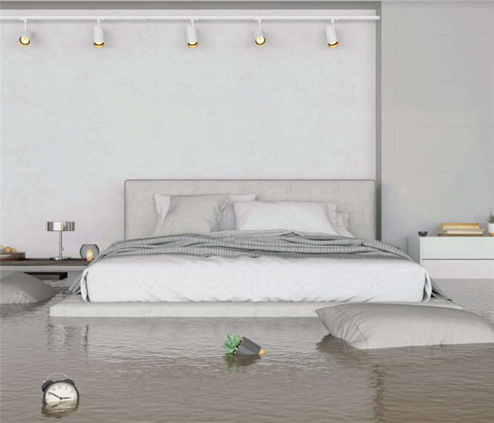 a flooded bedroom with furniture floating everywhere